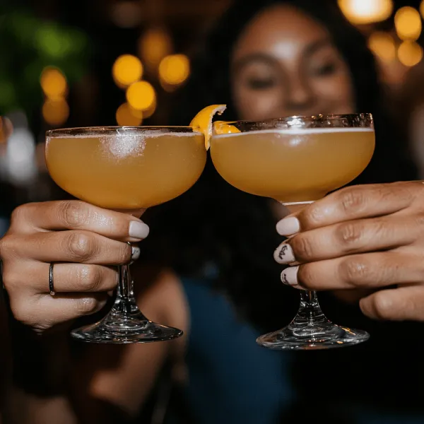 Guests toasting cocktails